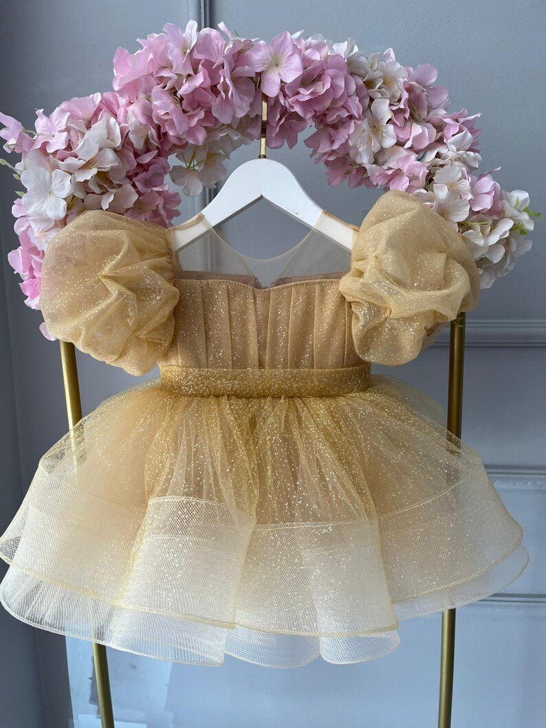23947b55db22684d Champagne Gold Glitter Fairy Frock - Image 1